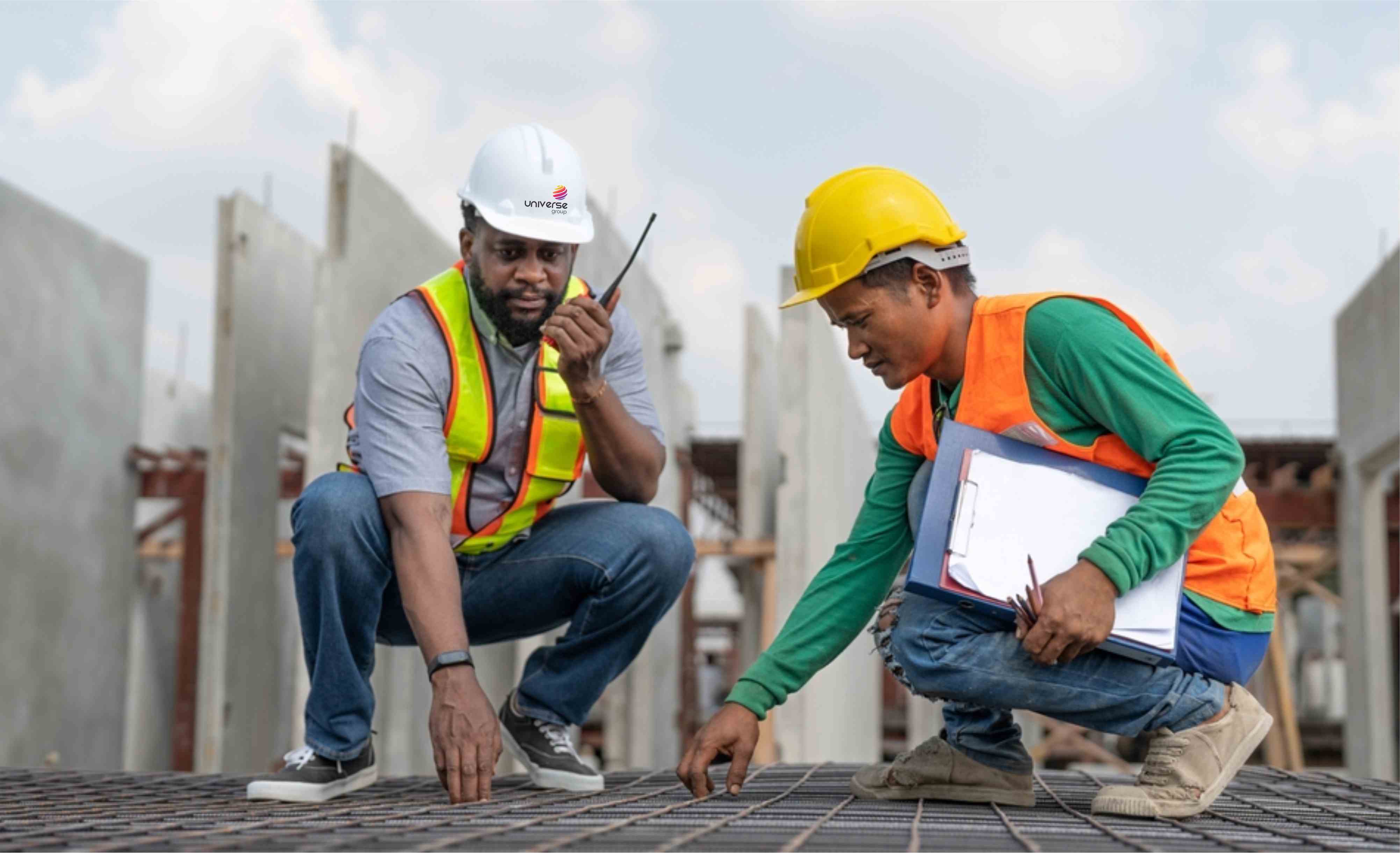 Construction workers putting up solar panels